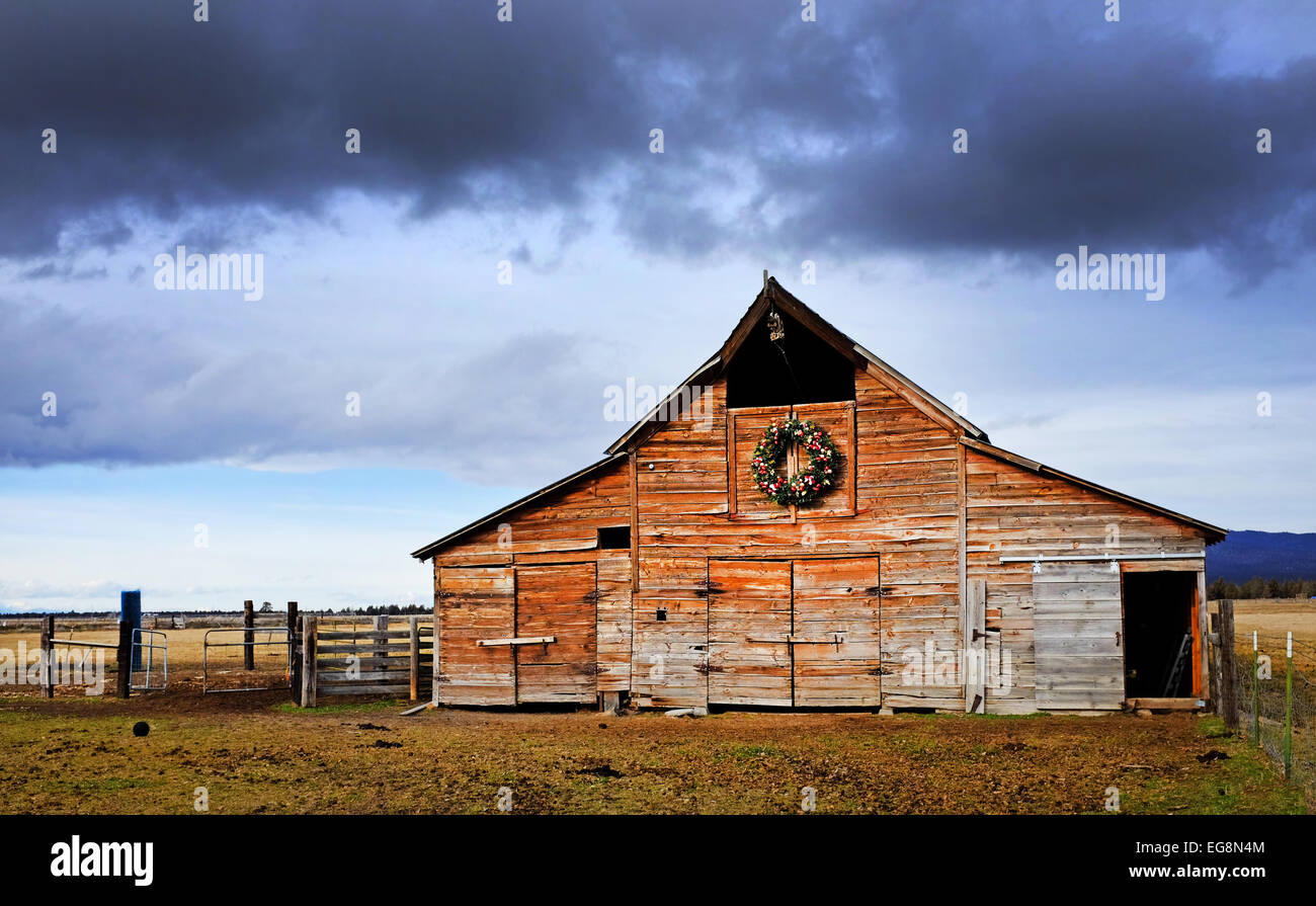 A hundred year old wooden barn in the high desert of central Oregon. Stock Photo