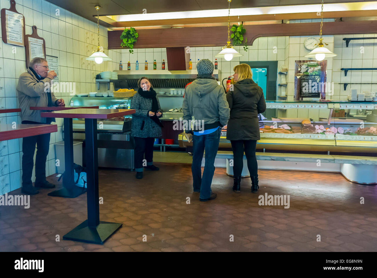 Retailers people inside german delicatessen hires stock photography