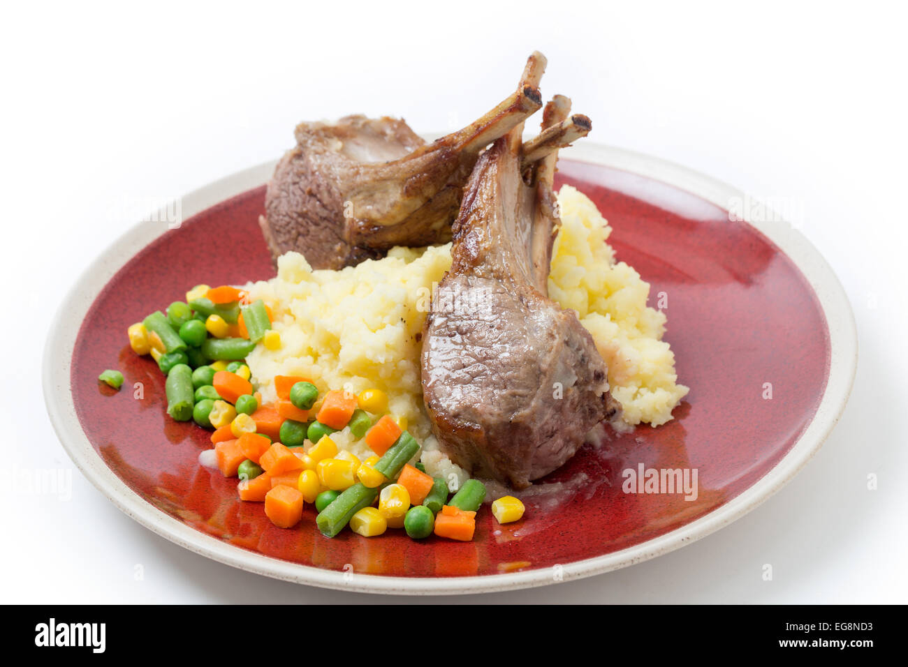 Lamb chops on a bed of potato with mixed vegetables Stock Photo Alamy