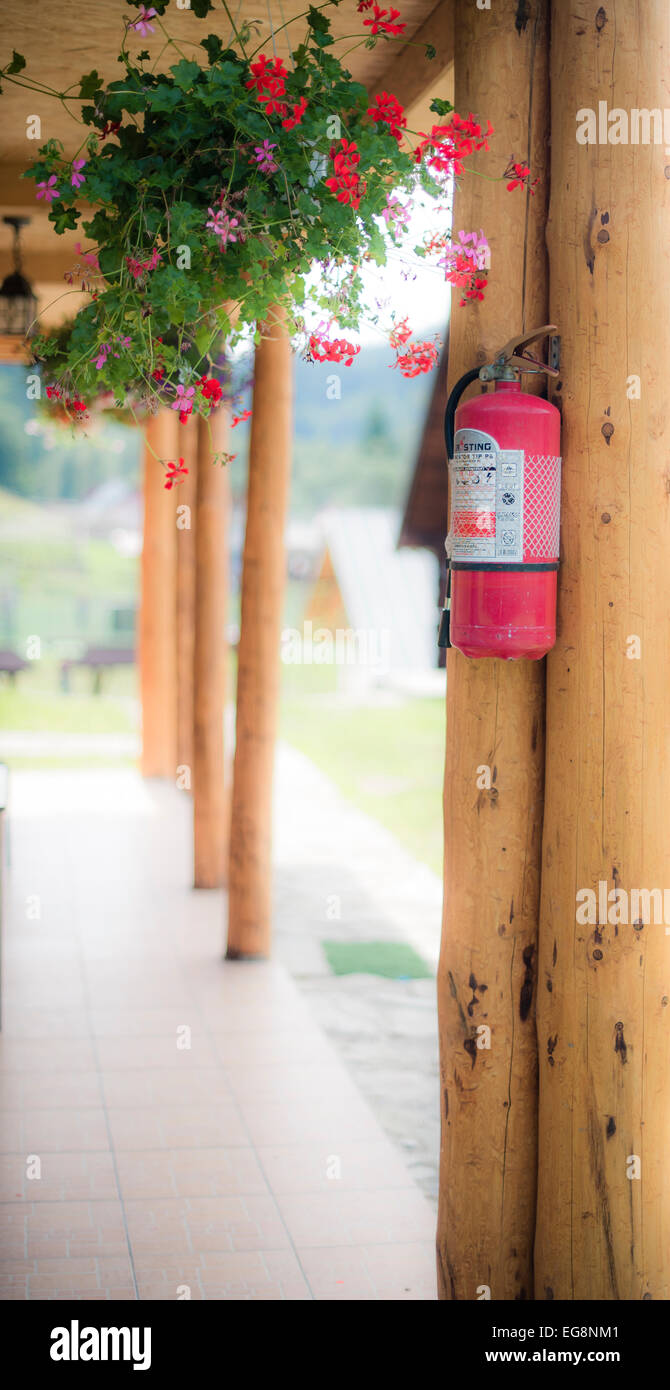 Extinguisher in the corner Stock Photo