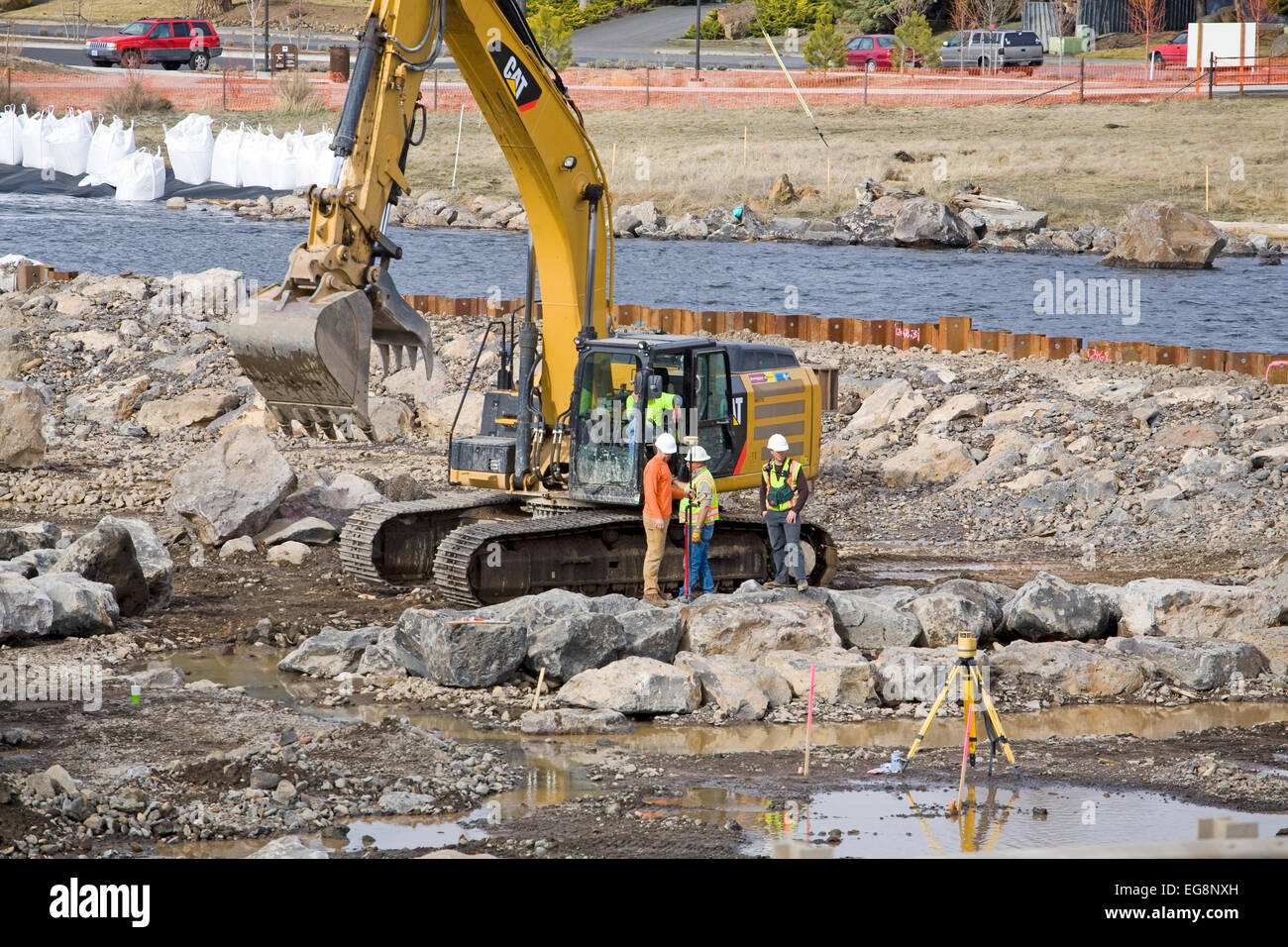 Heavy earthmoving shovels and other equipment working on changing the