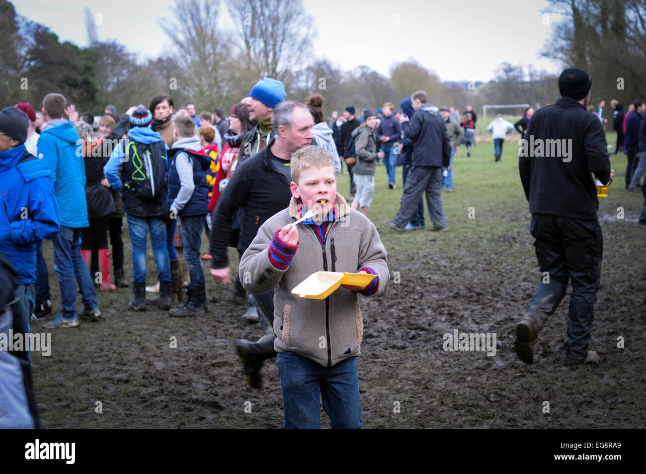Ashbourne Shrovetide Football Match 2015 Young Lad Eating Chips . Stock Photo