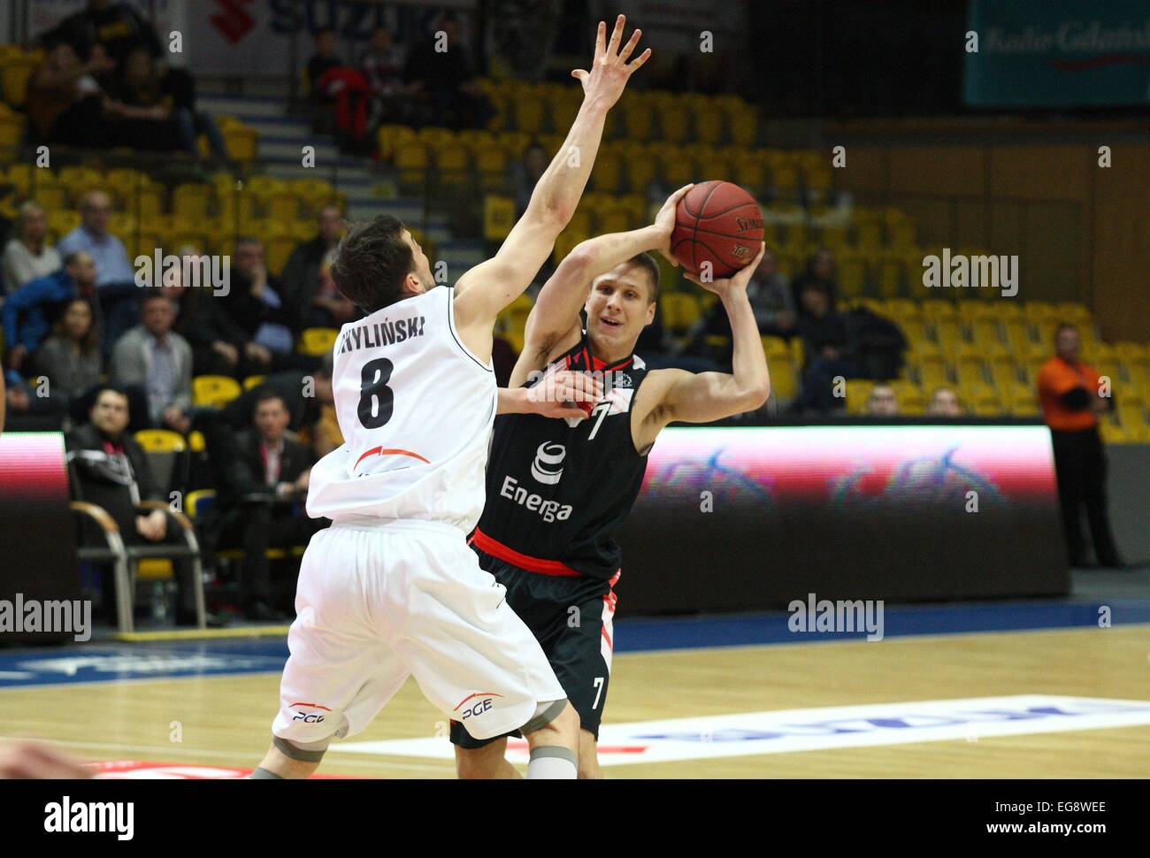 Gdynia, Poland. 19th February, 2015. Basketball: Cup of Poland final games. PGE Turow Zgorzelec faces energa Czarni Slupsk at Gdynia Arena sports hall. Tomasz Snieg (7) in action against Michal Chylinski (8) during the game Credit:  Michal Fludra/Alamy Live News Stock Photo