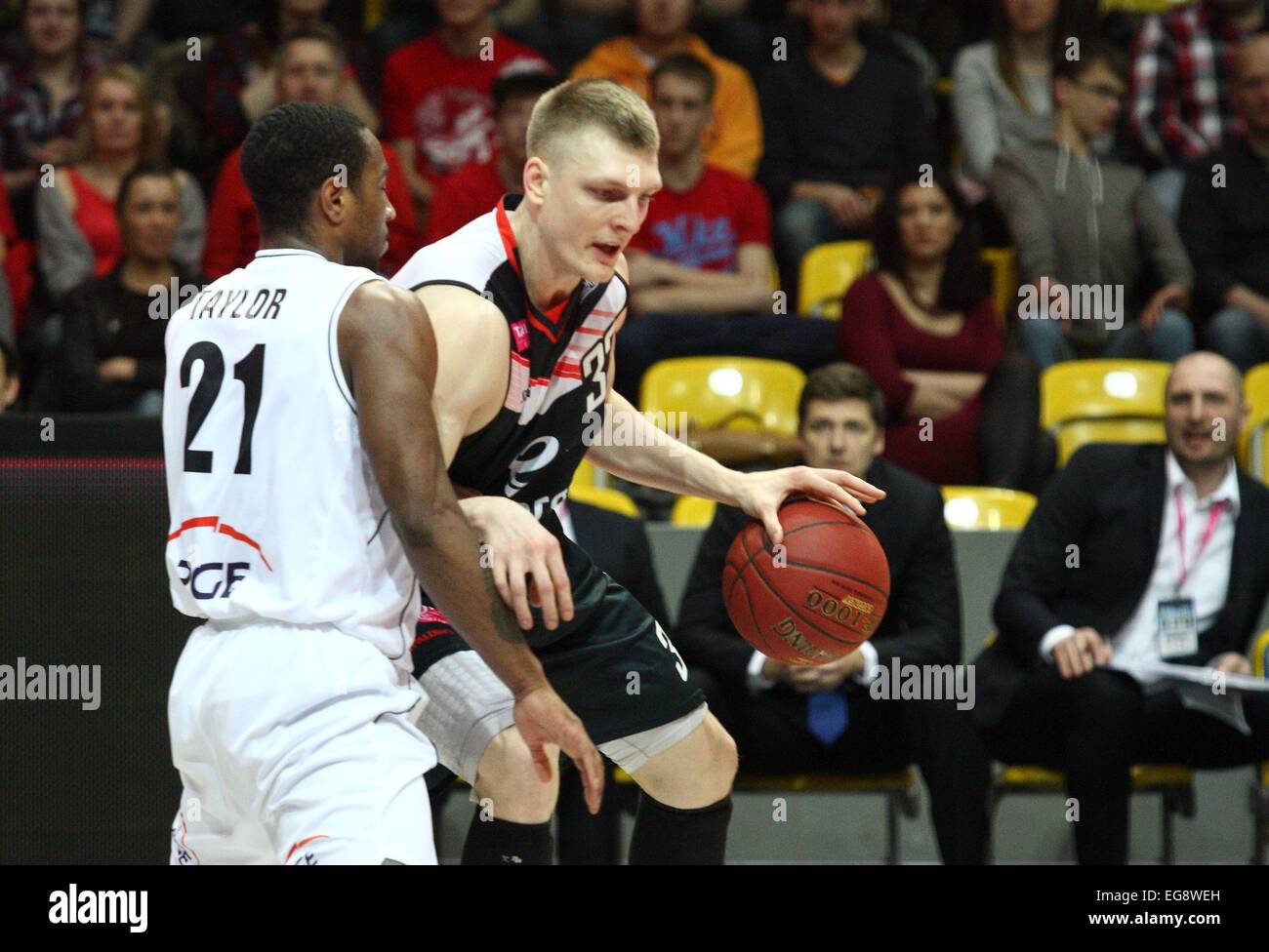 Gdynia, Poland. 19th February, 2015. Basketball: Cup of Poland final games. PGE Turow Zgorzelec faces energa Czarni Slupsk at Gdynia Arena sports hall. Karol Gruszecki (33) in action against Tony Taylor (21 during the game Credit:  Michal Fludra/Alamy Live News Stock Photo