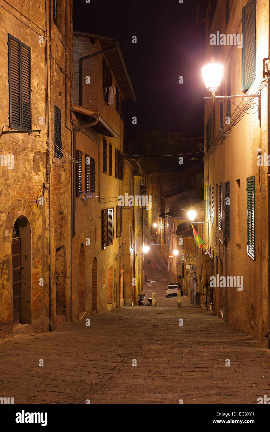 Night view of medieval street in Siena, Italy Stock Photo - Alamy