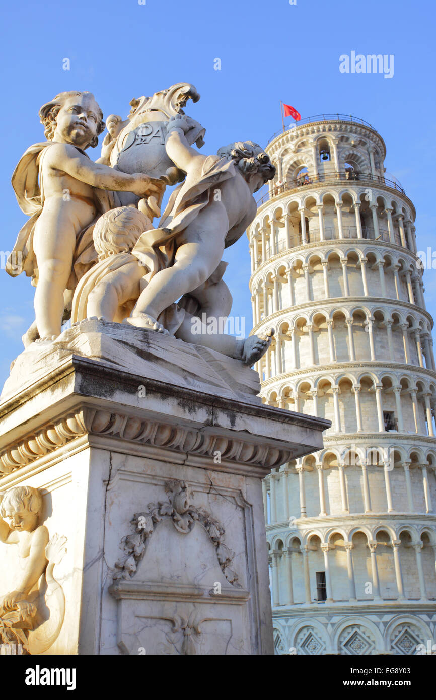 The statue of angels on Square of Miracles in Pisa and Leaning Tower