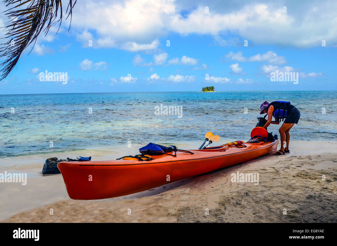 Kayaker on an island beach, barrier reef, Belize. Stock Photo