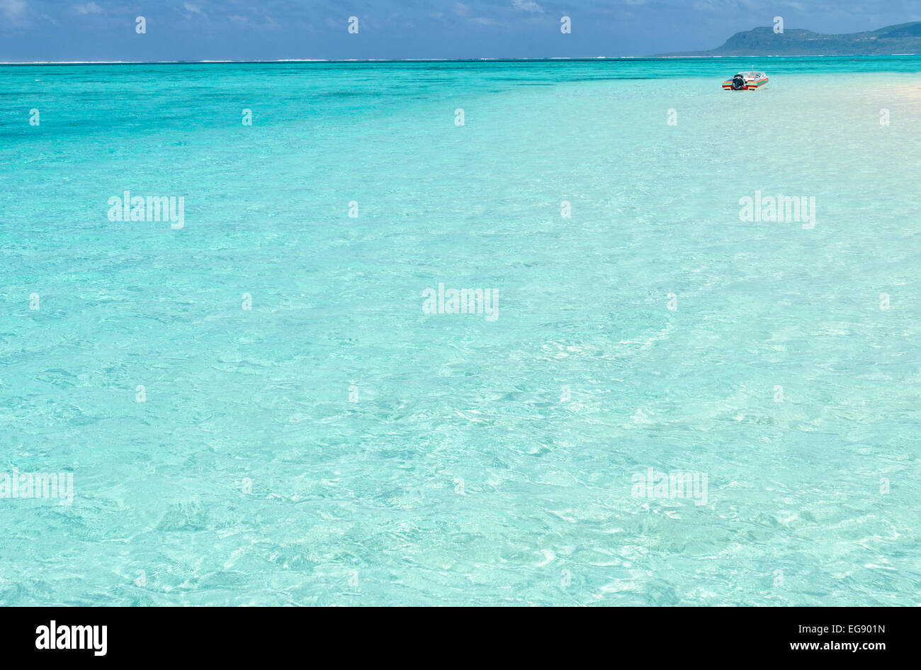 Tropical turquoise water and boat near Saipan, Micronesia. Stock Photo
