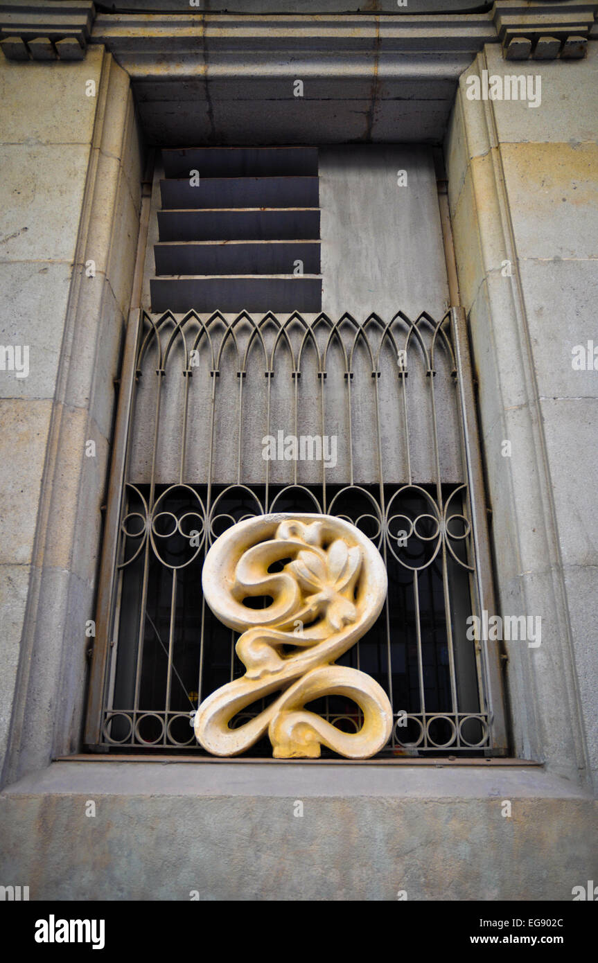 Barcelona Spain window with stone carving Stock Photo