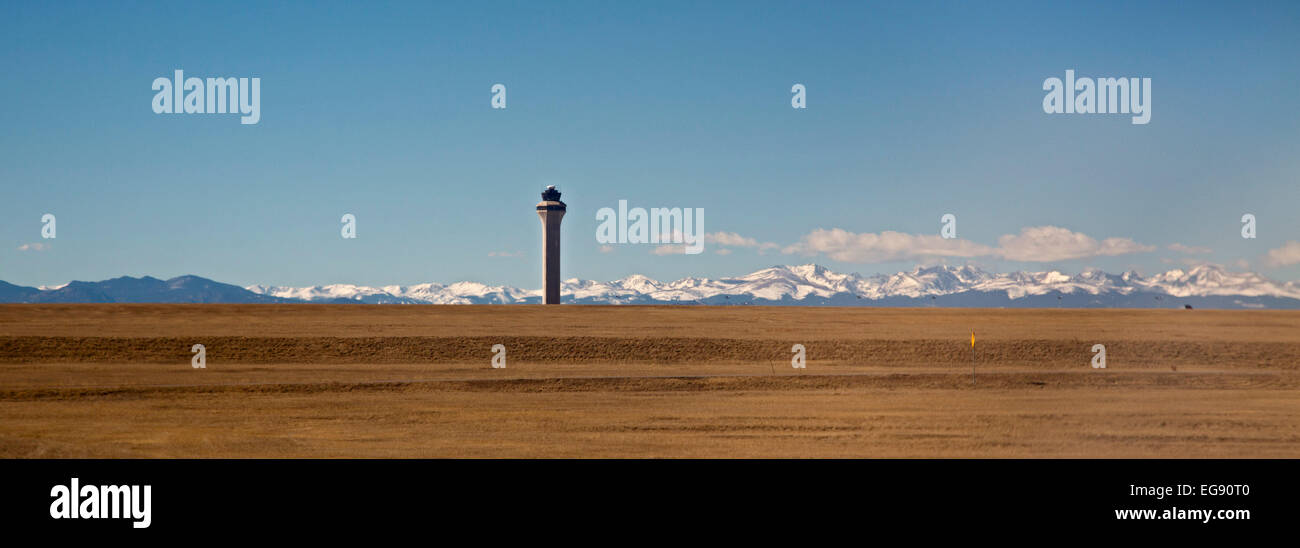 Denver, Colorado - The control tower at Denver International Airport, with the snow-capped Rocky Mountains in the distance. Stock Photo