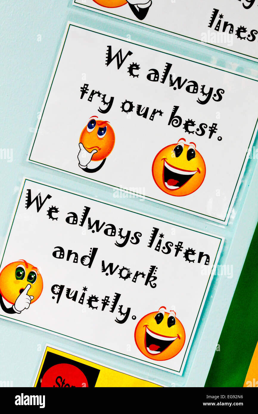 Primary school wall display with We Always Try Our Best and We Always Listen and Work Quietly motivational messages for children Stock Photo