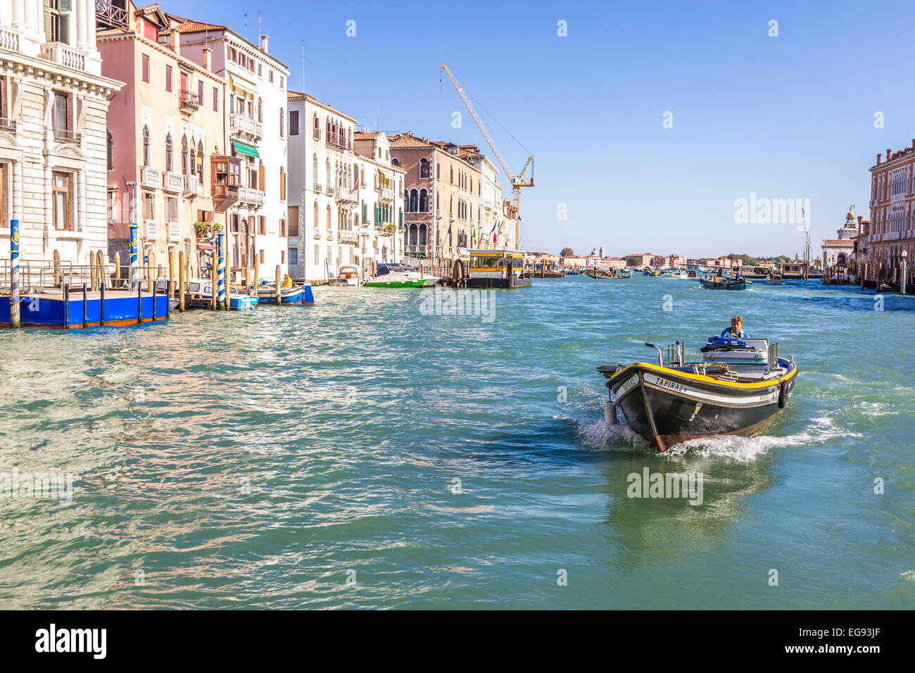 Workboat on canal in Venice Stock Photo