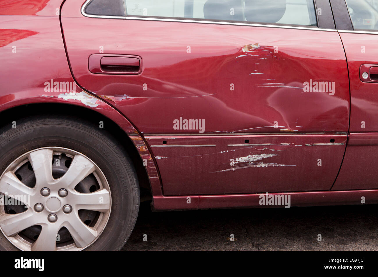 Scratched rear door of sedan - USA Stock Photo