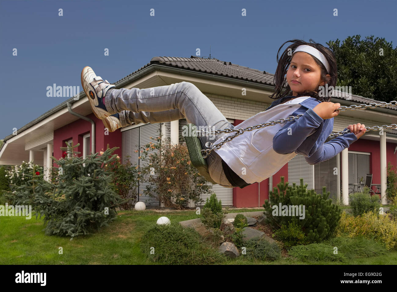 Happy child girl playing at new family house Stock Photo - Alamy