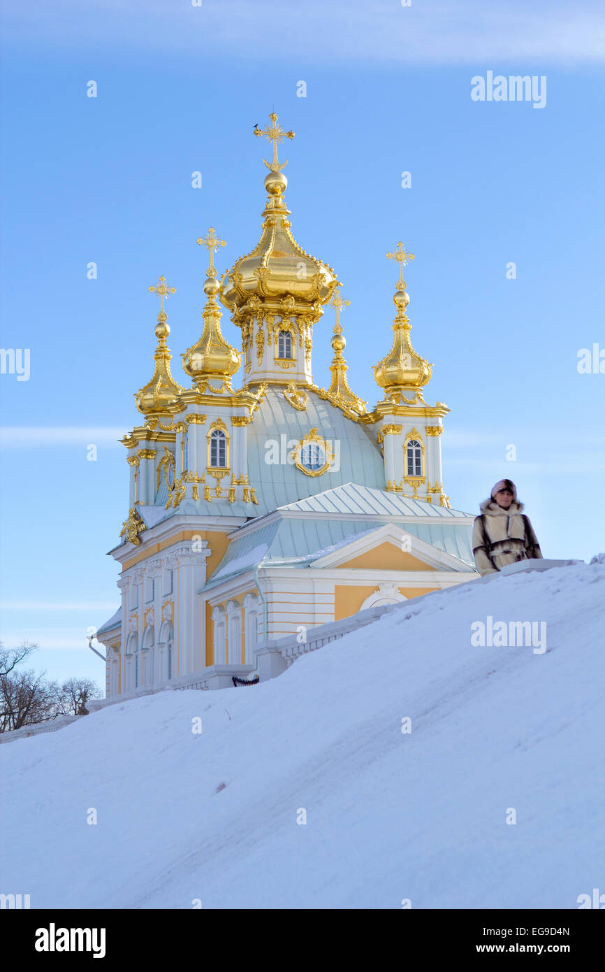 young women near beautiful church in winer. Petergof, St. Petersburg