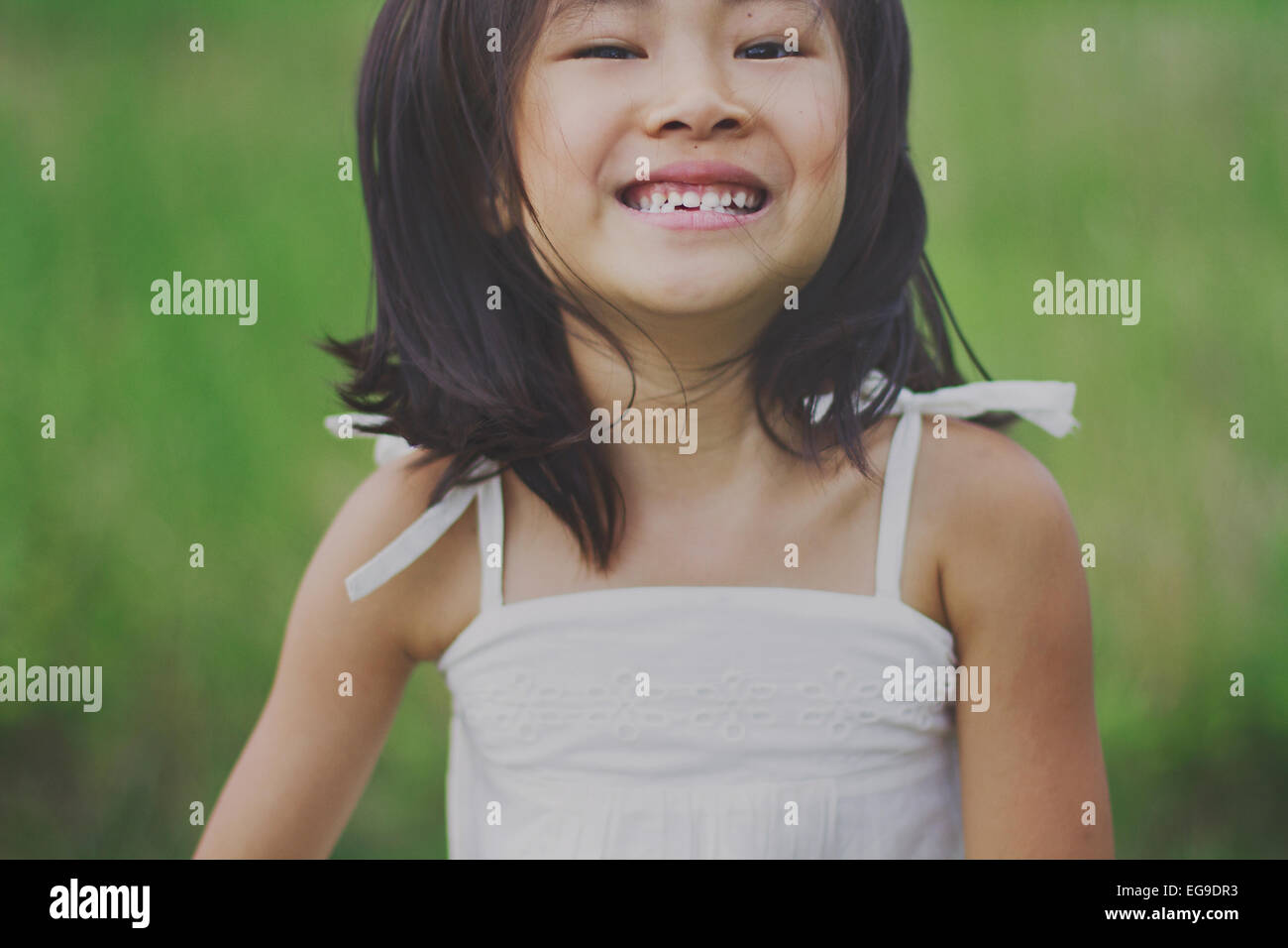 Portrait of smiling girl (8-9) Stock Photo