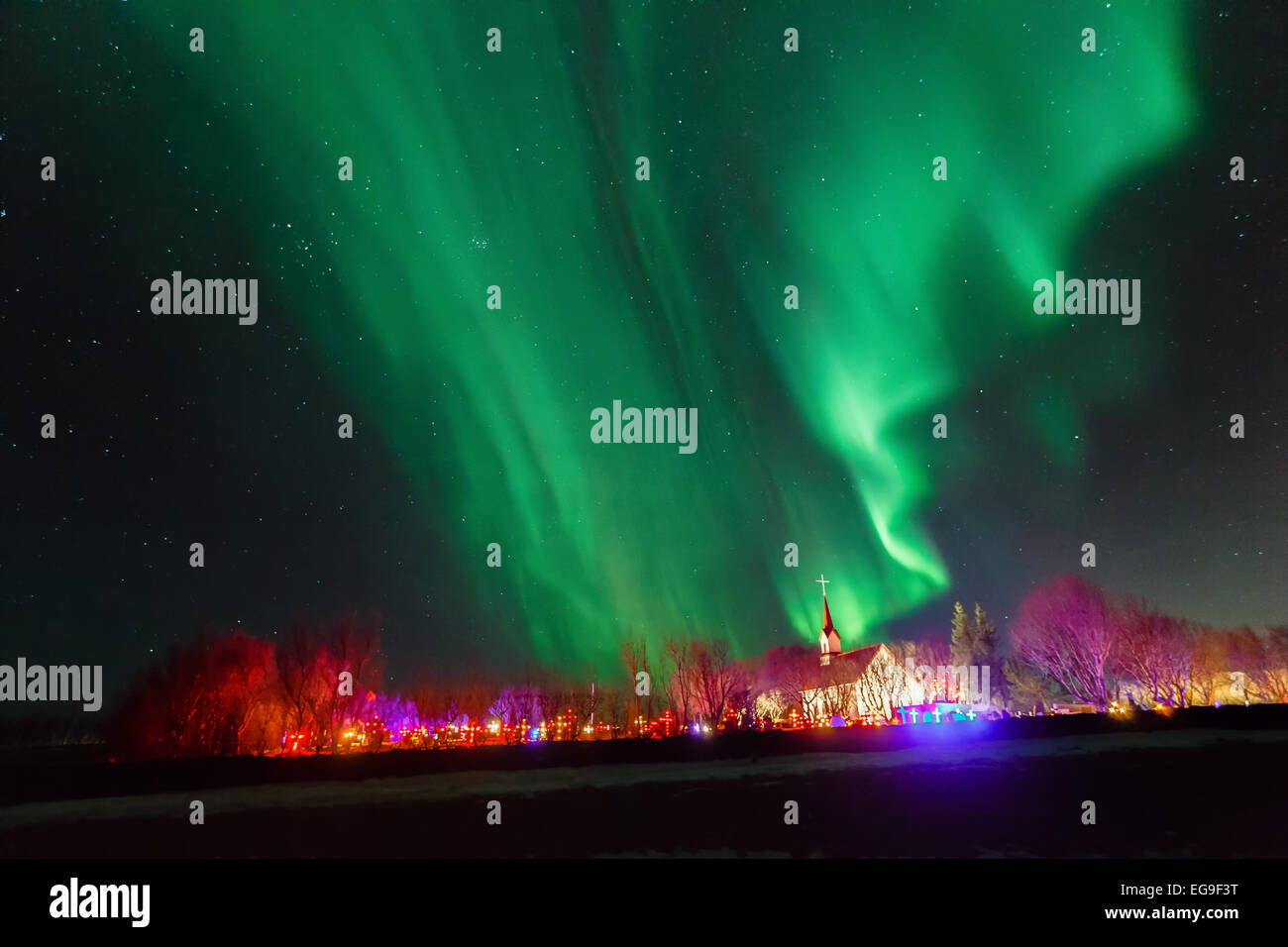 Northern lights over illuminated church at night, Reykjavik,  Iceland Stock Photo