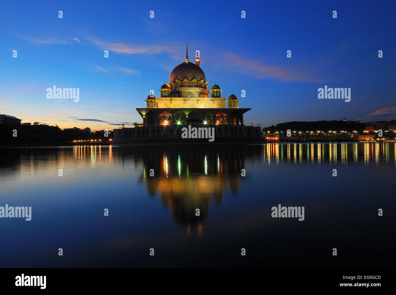 Malaysia, Putrajaya, Mosque reflecting in lake at dusk Stock Photo