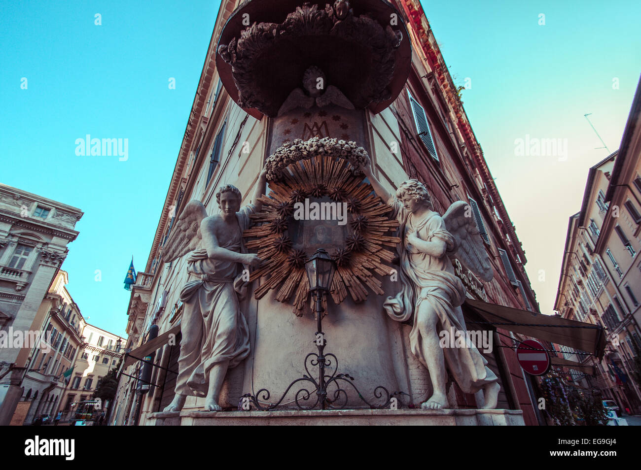 Italy, Rome, Low angle symmetrical view of building corner with angel sculptures Stock Photo