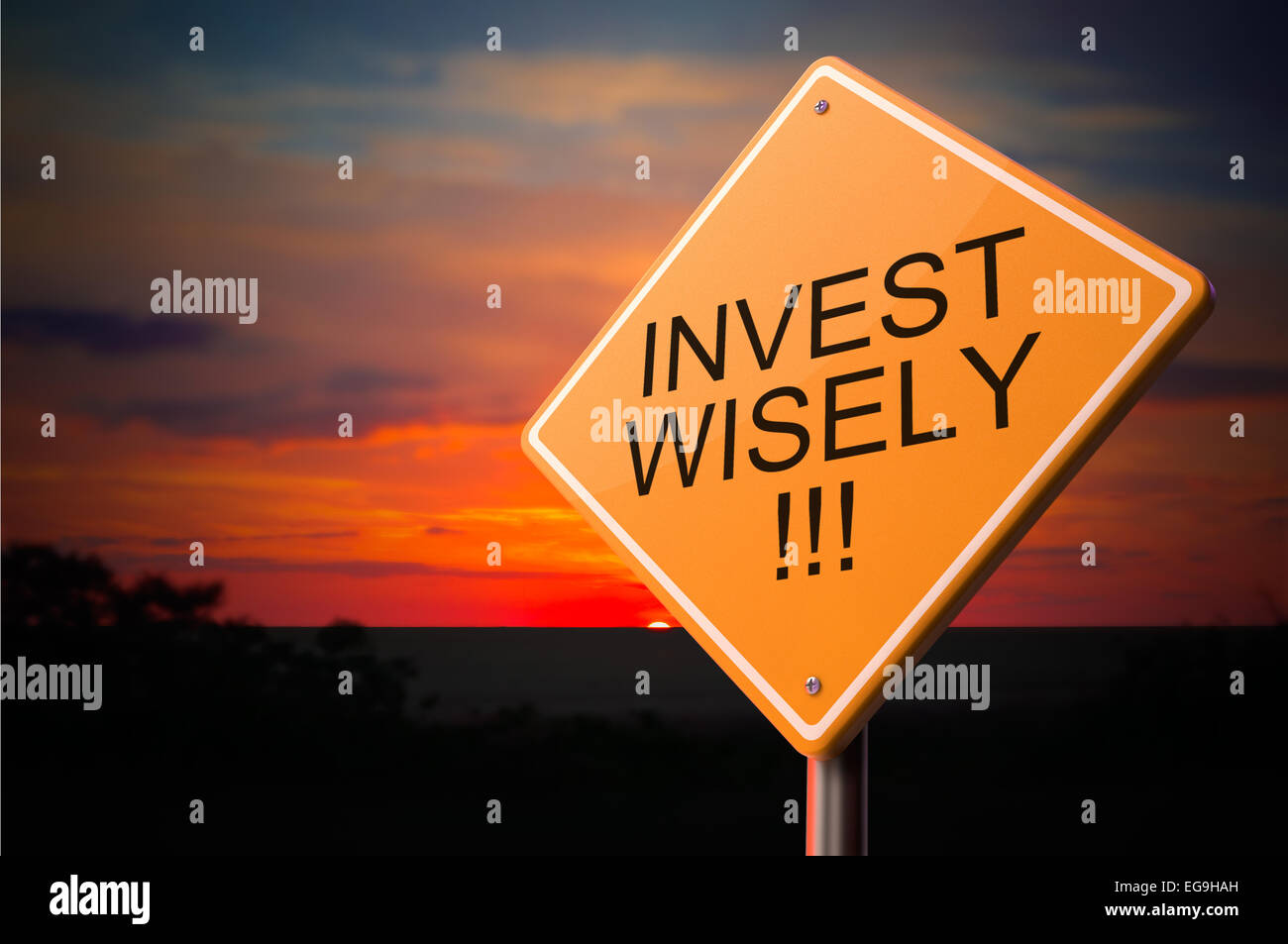 Invest Wisely on Warning Road Sign on Sunset Sky Background. Stock Photo