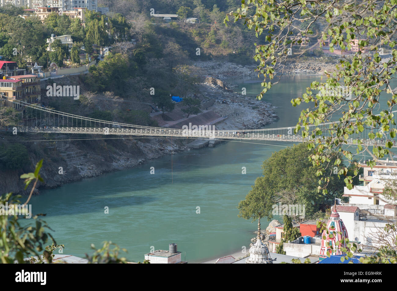 Looking down at Lakshman Jhula bridge which crosses the Ganges or Ganga river in the town of Rishikesh, Uttarakhand, India Stock Photo