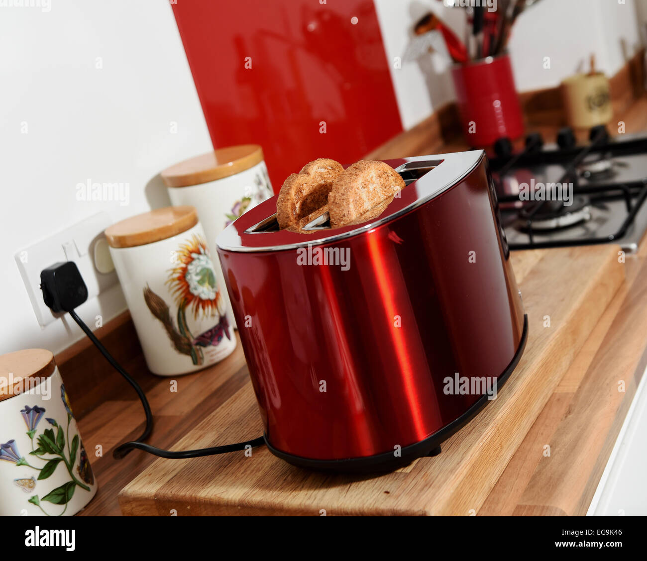 Electrical toaster in kitchen with cooked toast made from brown bread Stock Photo Alamy