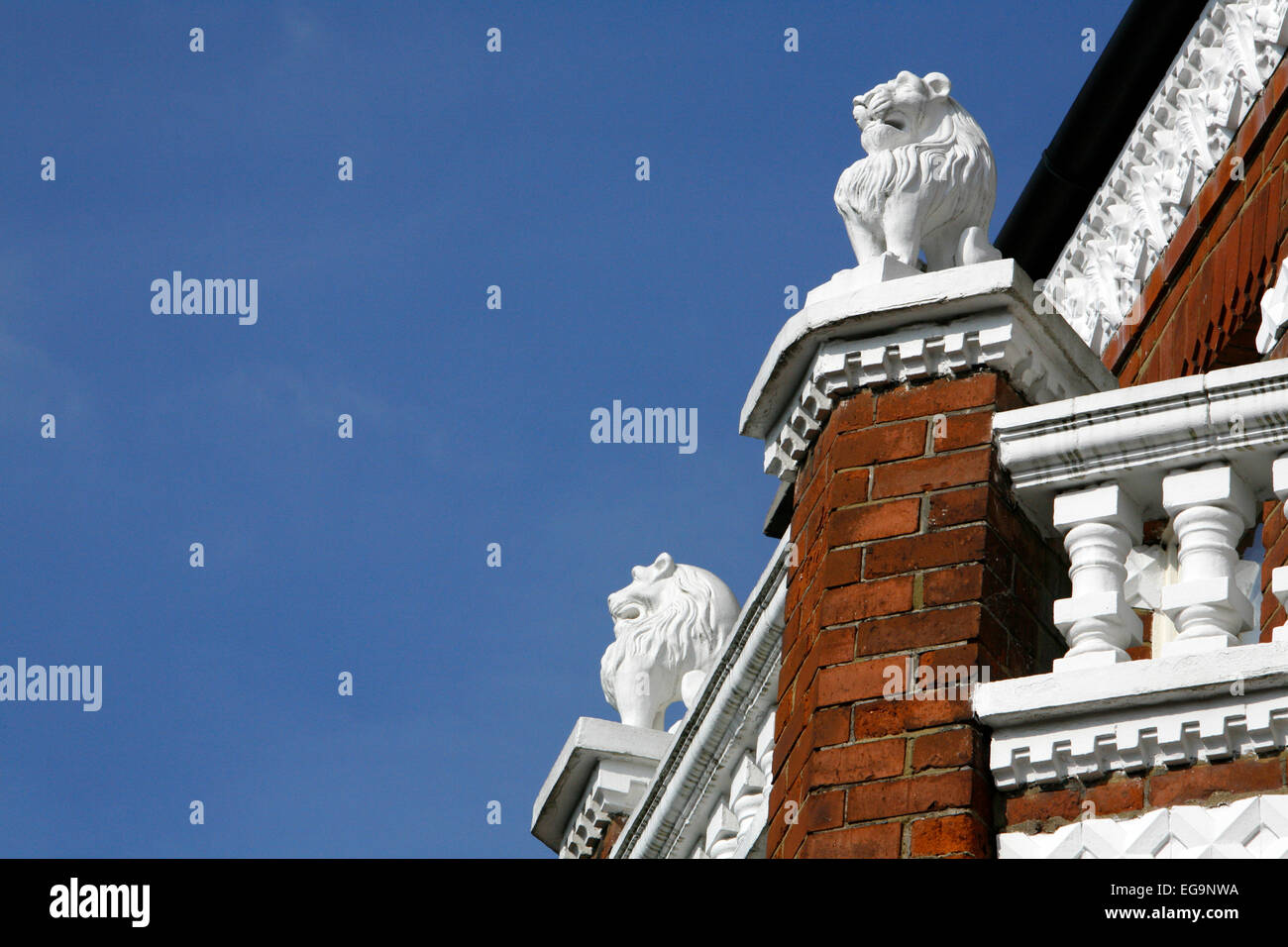 Lion motifs on top of housing on Perrymead Street, Fulham, London, UK Stock Photo