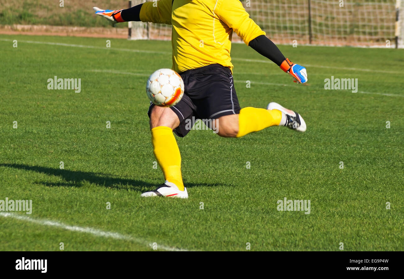 Goalkeeper kicks off the ball Stock Photo