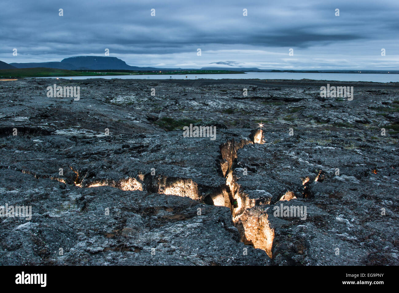 Diverging plates in a volcanic fissure zone, Myvatn, Iceland The fissures were lighted with a strobe light , Myvatn Iceland Stock Photo