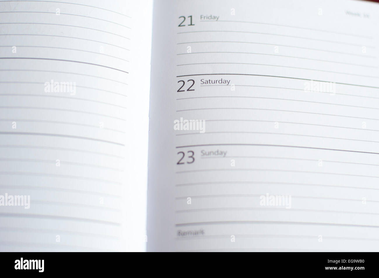 a blank page in a diary focusing on a weekend saturday and sunday symbolising free time or loneliness Stock Photo