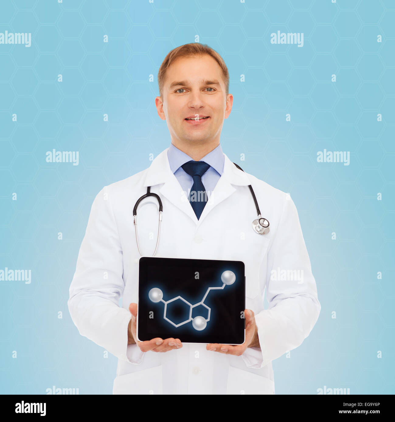smiling male doctor showing tablet pc screen Stock Photo