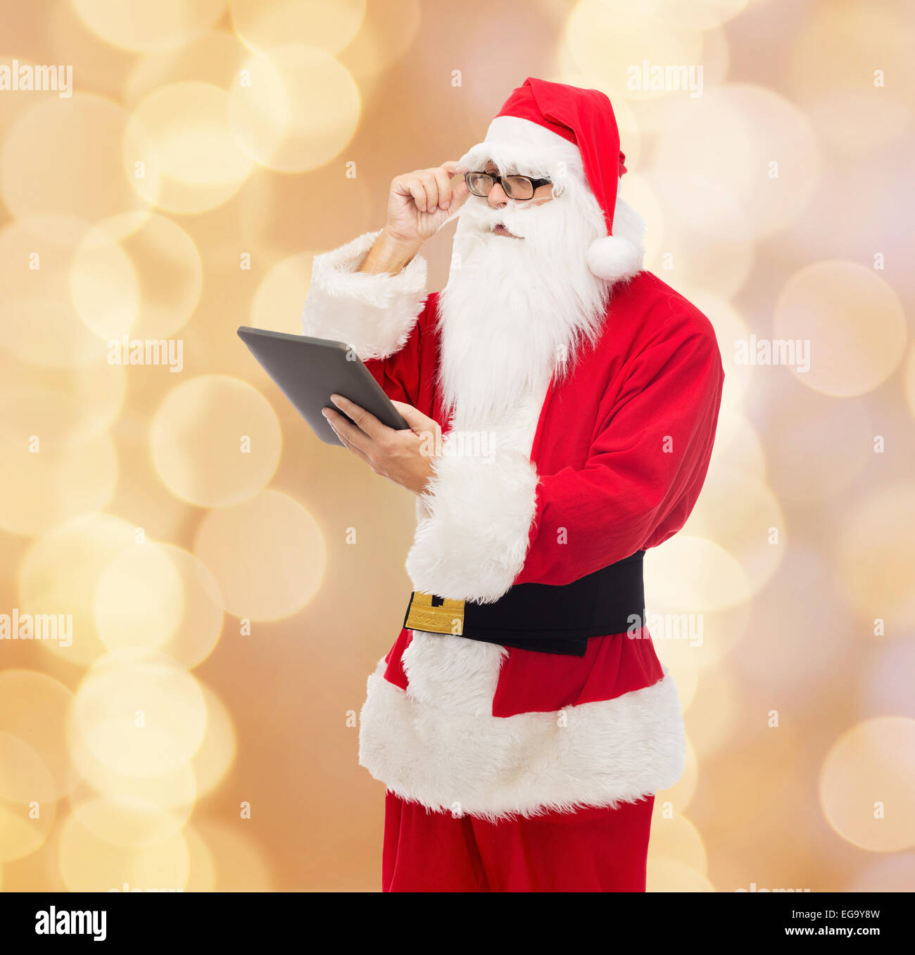 man in costume of santa claus with tablet pc Stock Photo - Alamy