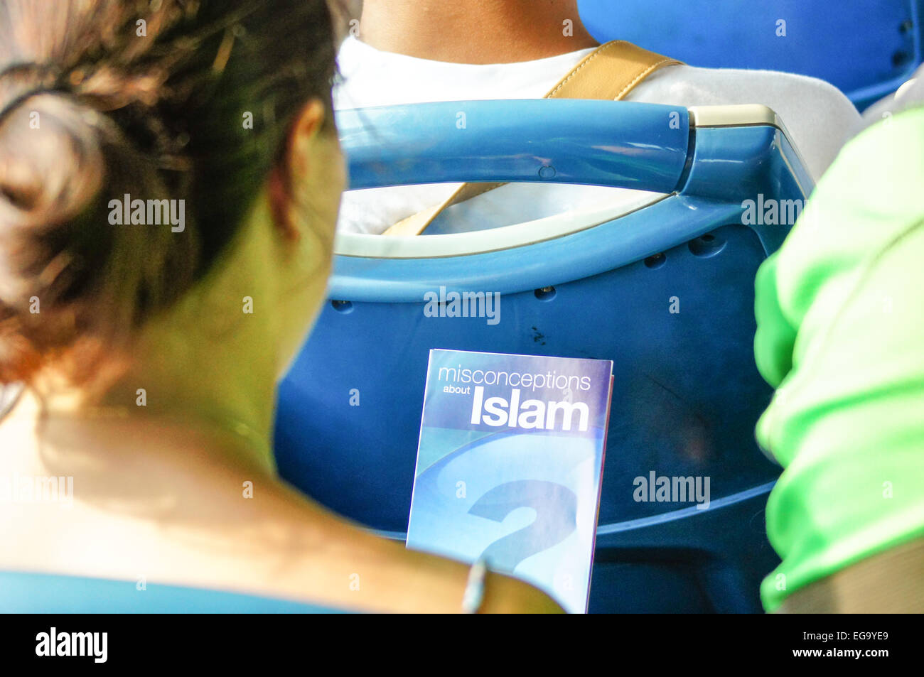 Women Reading A leaflet about Islam and how it is not a religion of extremism. Stock Photo