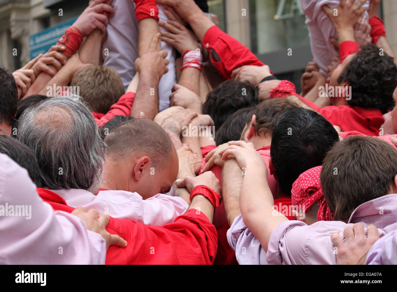 Castellers building human towers in Portal de l'Àngel, Barcelona, Catalonia, Spain Stock Photo