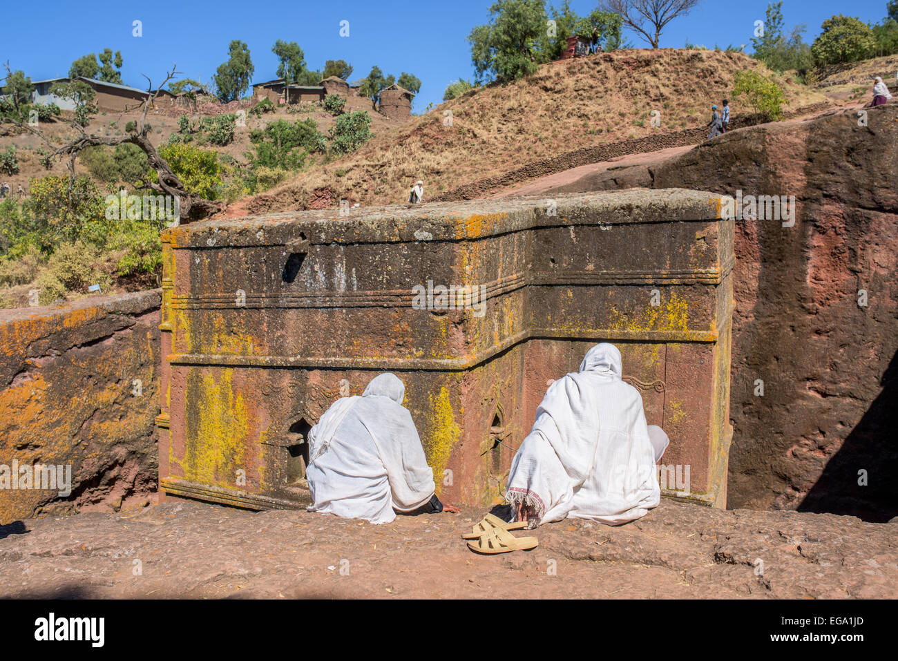 Pilgrims sitting in front of the Saint George church in Lalibela Ethiopia Stock Photo