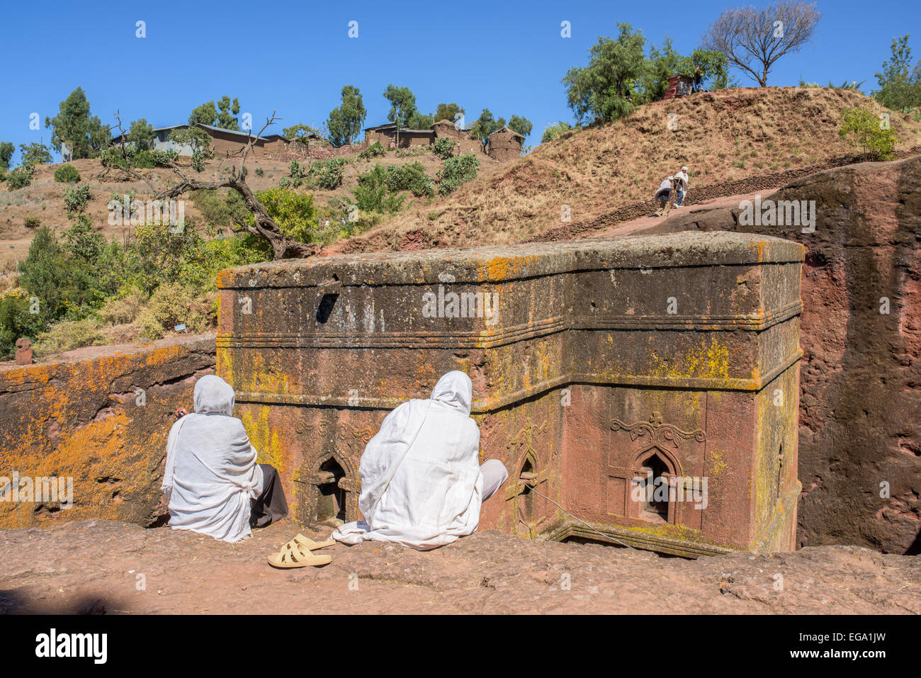 Pilgrims sitting in front of the Saint George church in Lalibela Ethiopia Stock Photo