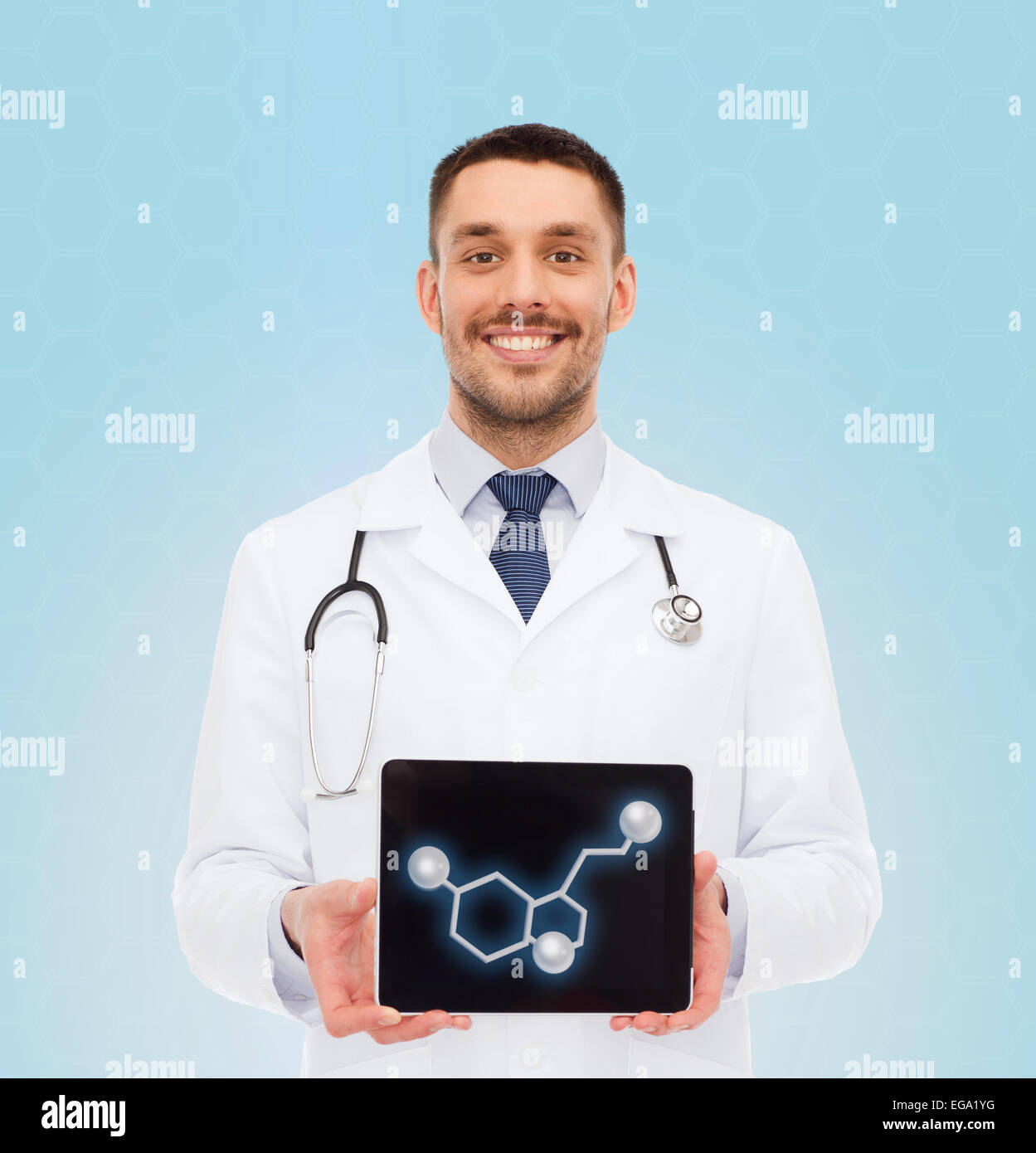 smiling male doctor showing tablet pc screen Stock Photo