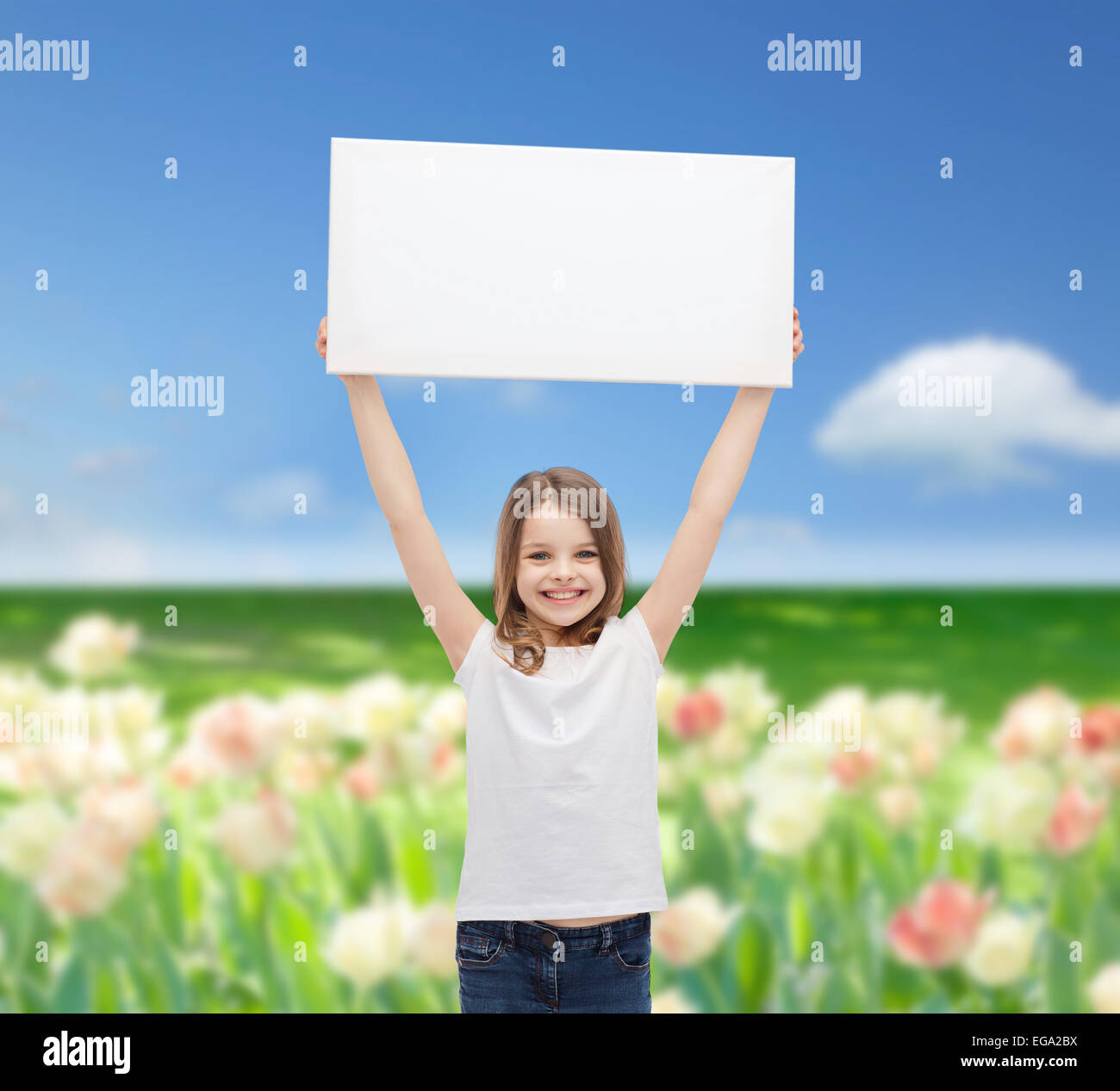 smiling little girl holding blank white board Stock Photo - Alamy