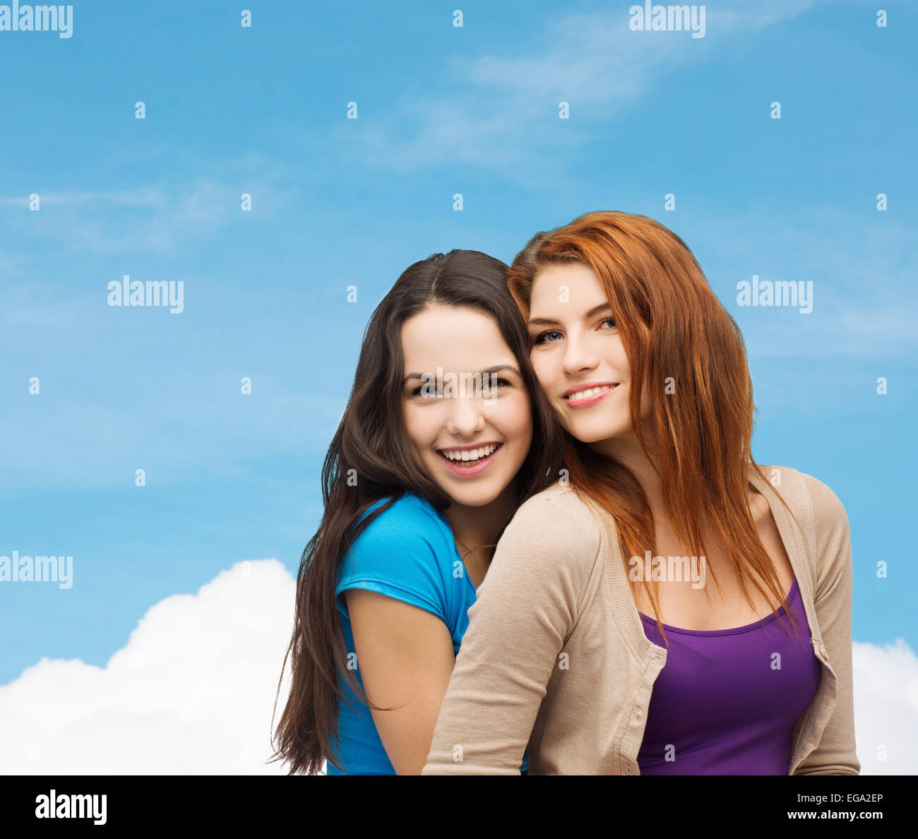 smiling teenage girls hugging Stock Photo - Alamy