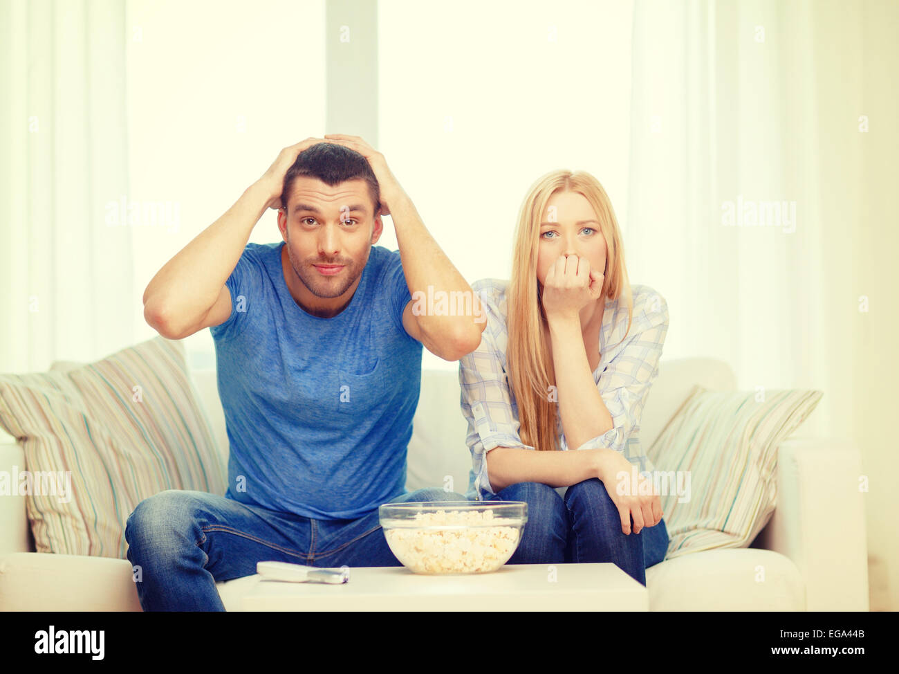 upset couple after sports team loss Stock Photo