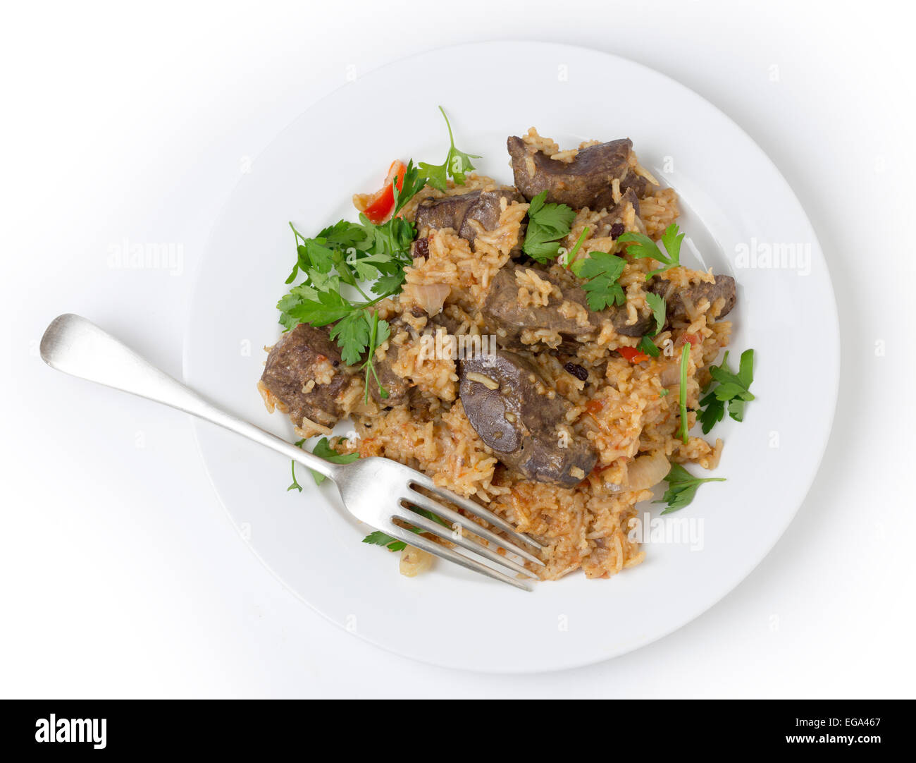 lightly fried lambs liver chunks baked on top of a pilaf of rice, onion, tomato, capsicum and dried currants in a chicken broth, Stock Photo