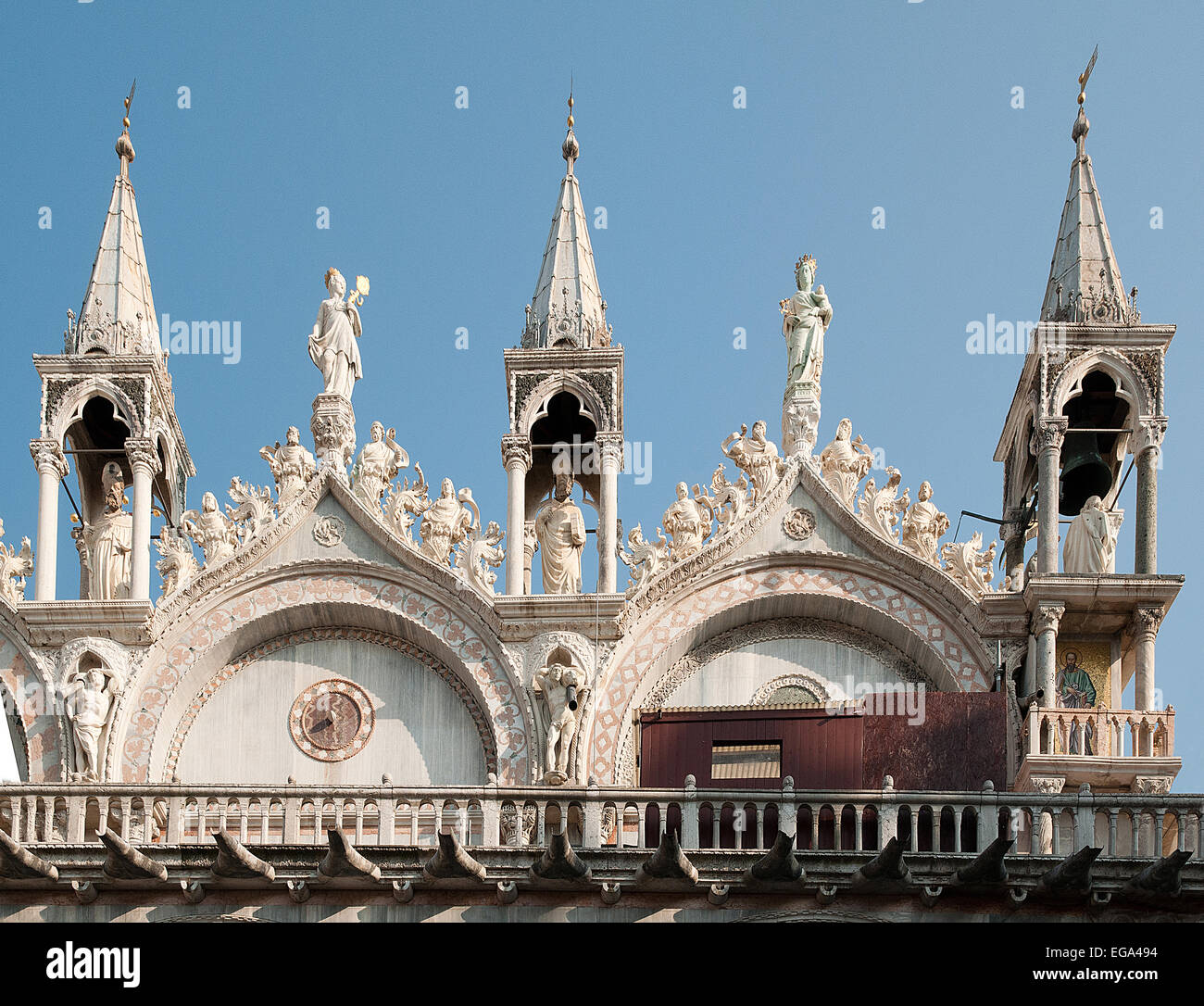 Detail of carved marble figures spires pinnacles on skyline and roof of Basilica San Marco St Marks Cathedral Venice Italy Stock Photo