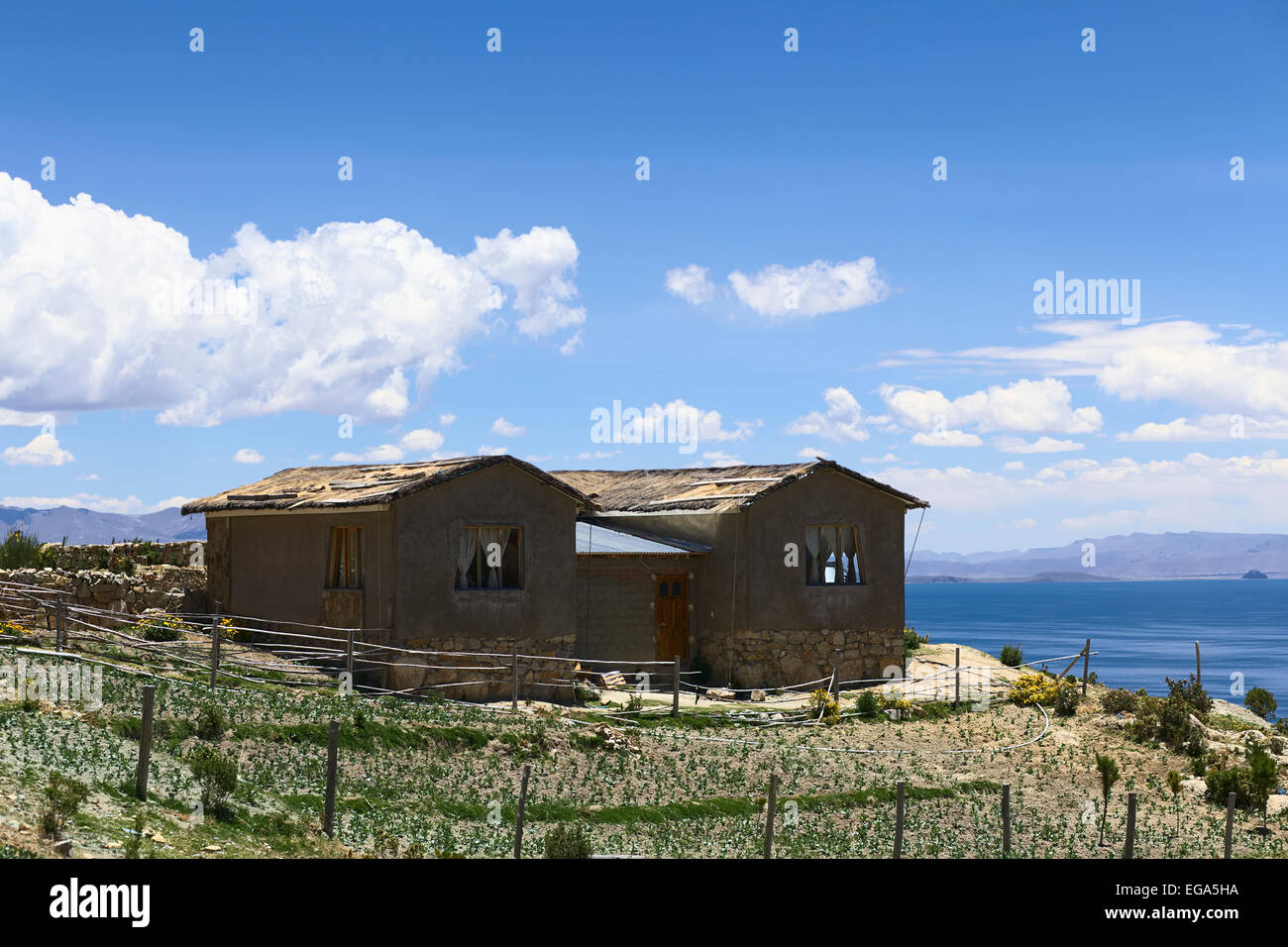House wih garden standing on hilltop in the southwestern part on Isla del Sol (Island of the Sun) in Lake Titicaca, Bolivia Stock Photo
