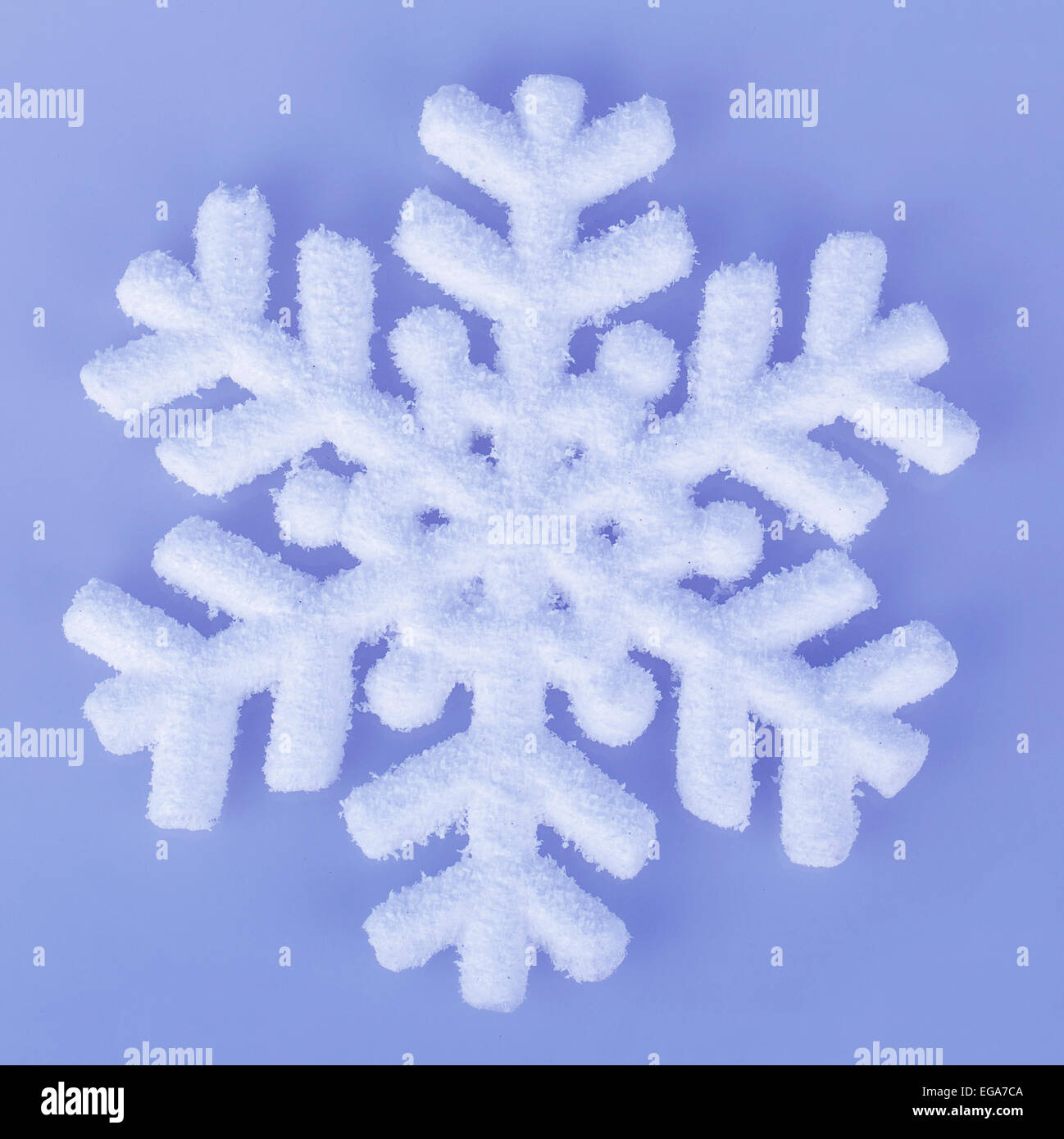 snowflake isolated on blue background Stock Photo - Alamy