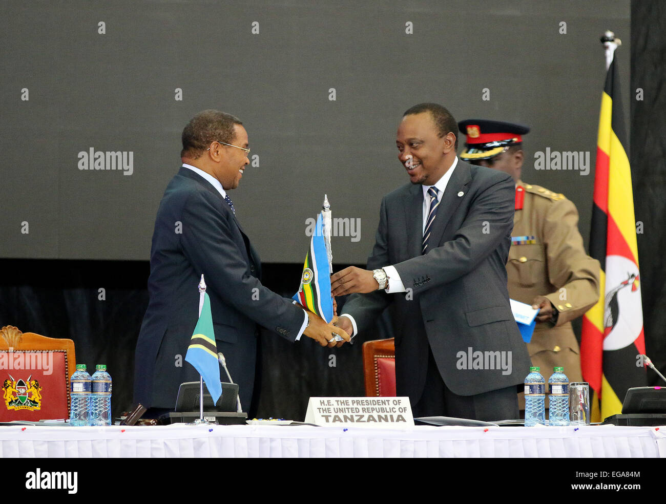 Nairobi, Kenya. 20th Feb, 2015. Kenyan President Uhuru Kenyatta (R) hands over the chairmanship of the East African Community(EAC) to Tanzanian President Jakaya Kikwete during the 16th EAC Heads of State Summit in Nairobi, capital of Kenya, Feb. 20, 2015. East African leaders on Friday called for immediate permanent cease-fire in South Sudan and the speedy implementation of the East African Monetary Union (EAMU). Credit:  Zhou Xiaoxiong/Xinhua/Alamy Live News Stock Photo