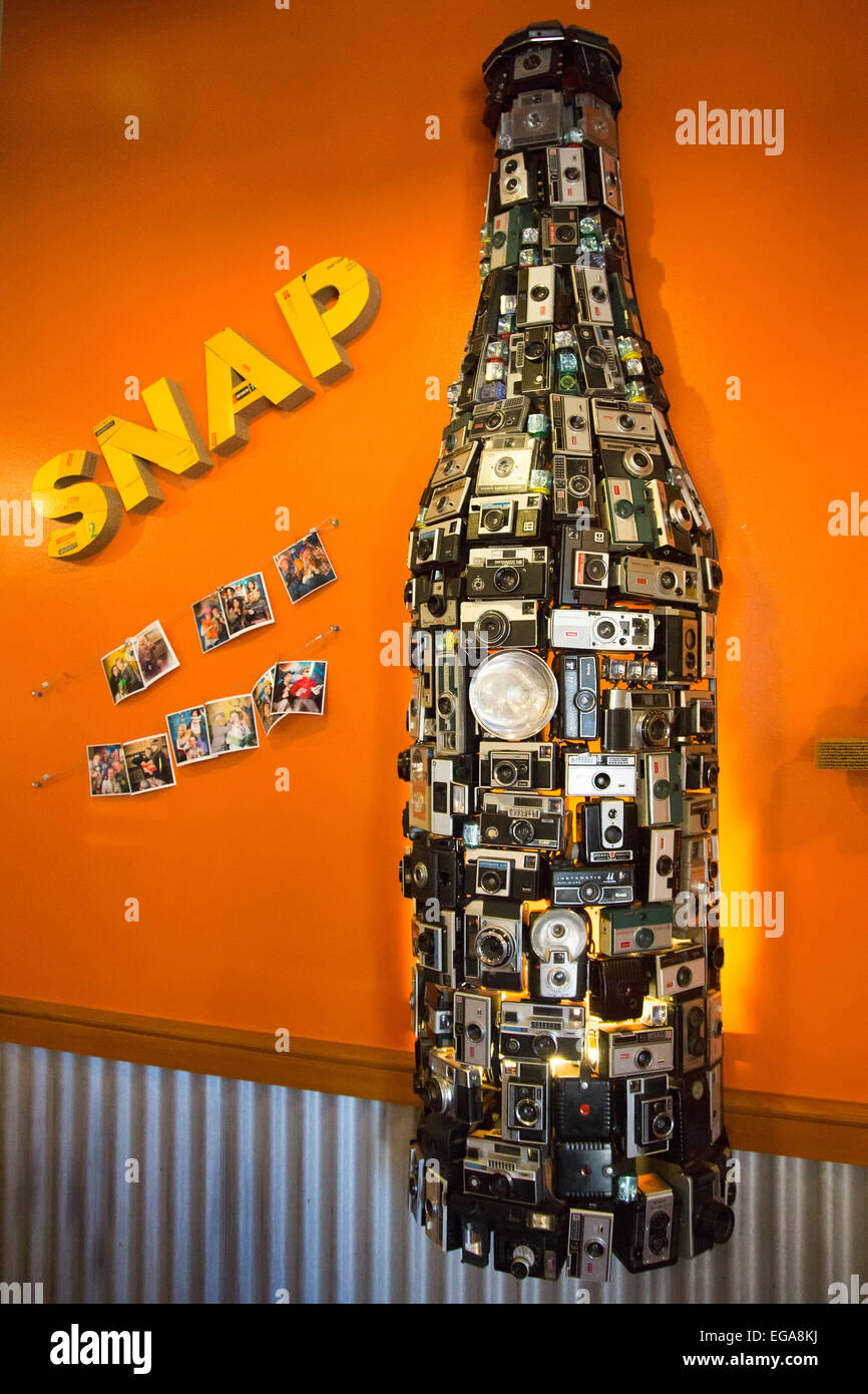 Fort Collins, Colorado - A display of old cameras shaped as a beer bottle at the New Belgium Brewery. Stock Photo