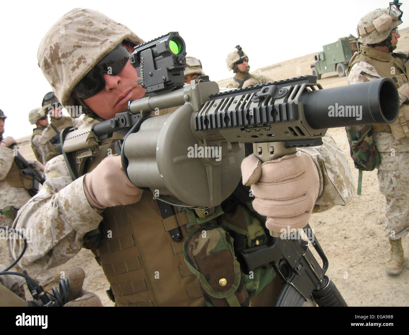 US MARINE aiming a M-32 Multiple shot Grenade Launcher,in 2006. It is an experimental six-barreled weapon that can deliver six 40 mm grenades in under three seconds.  Photo : US Marine Corps Stock Photo