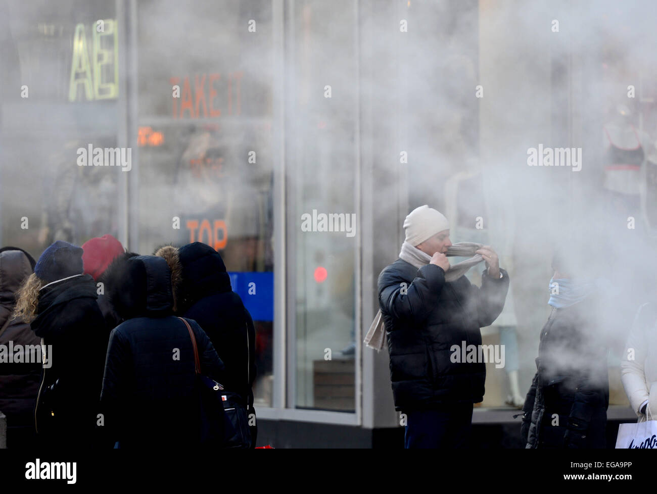 New York, USA. 20th Feb, 2015. People walk in low temperatures at Times Square in New York City, the United States, on Feb. 20, 2015. New York City Emergency Management has issued a weather alert for dangerous cold temperatures for Feb. 20, followed by a wintry mix of snow, sleet and freezing rain. A bitterly cold chill known as the "Siberian Express" has enveloped much of eastern America, sending temperatures plummeting below their normal February levels to record lows in at least 100 places. Credit: Wang Lei/Xinhua/Alamy Live News Stock Photo