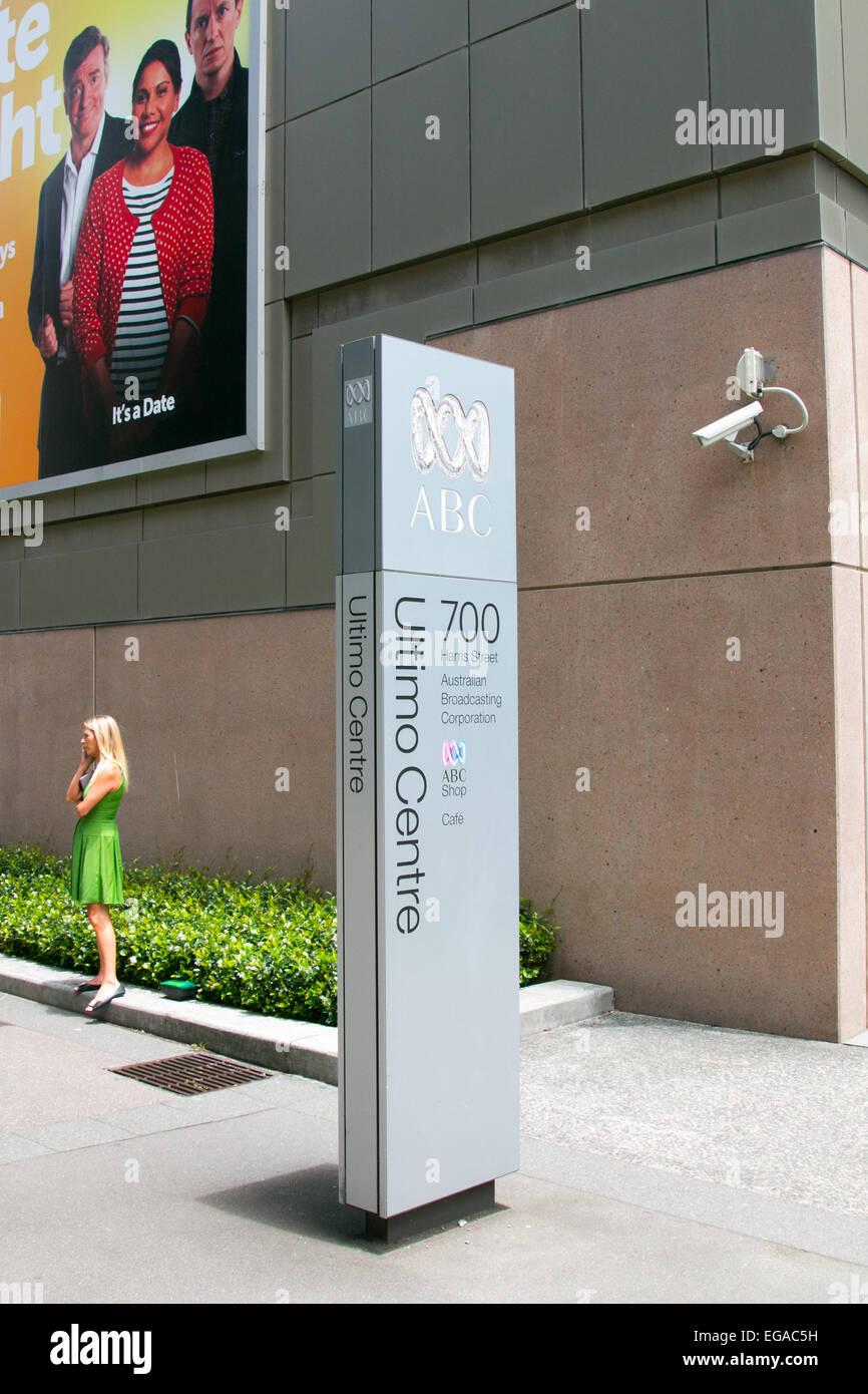 ABC, australian national broadcaster offices in ultimo Sydney,australia with lady outside talking on her mobile phone Stock Photo