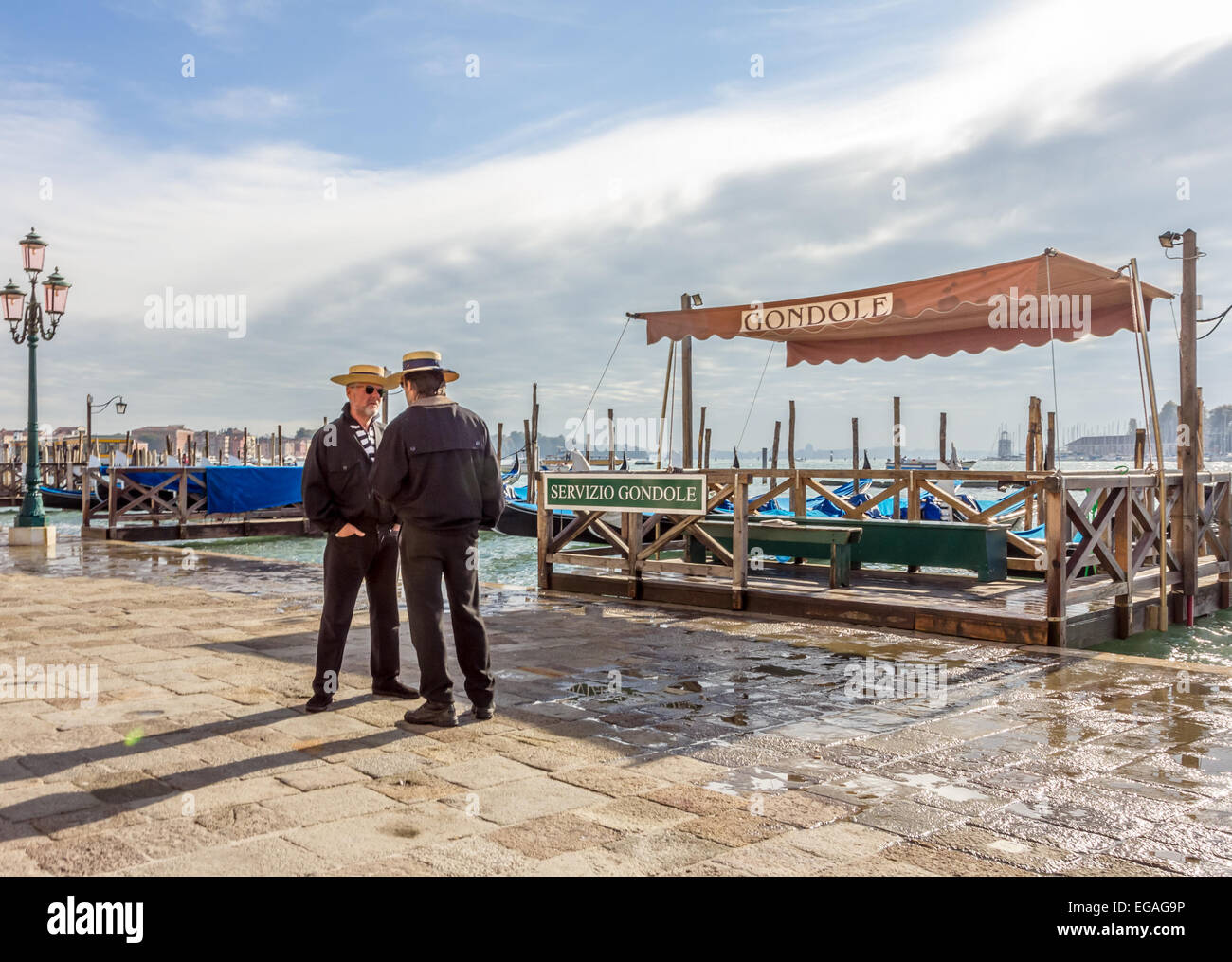 Two gondoliers in St Marks Square, Venice Stock Photo